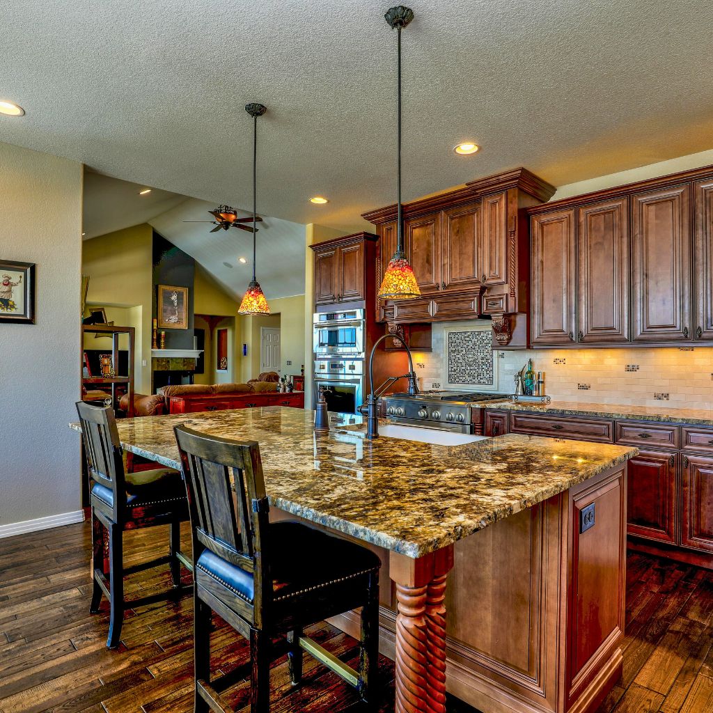 A kitchen with some wood details 